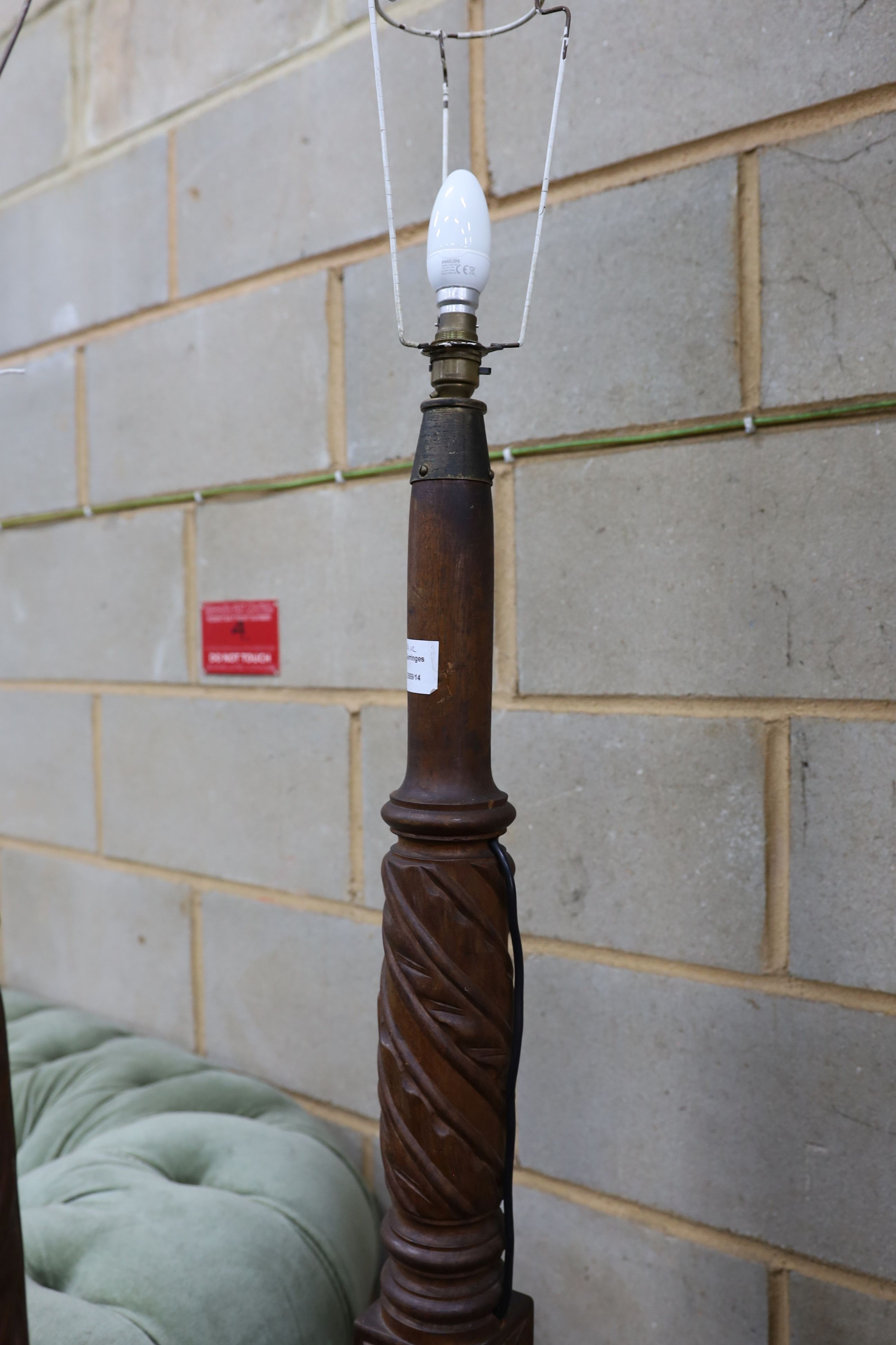 A pair of carved mahogany lamp standards, height 137cm